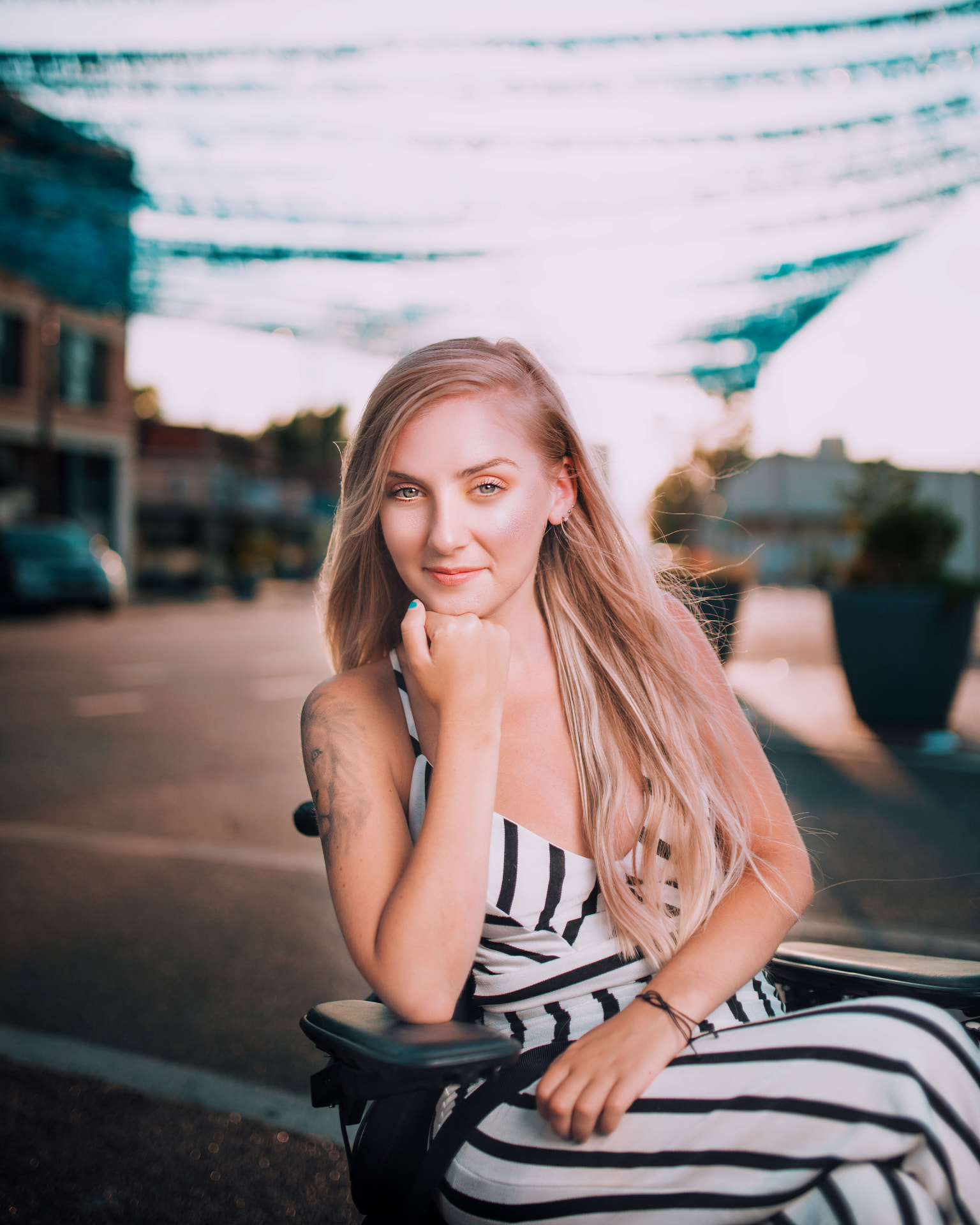 Golden hour brand portrait of a woman downtown at sunset