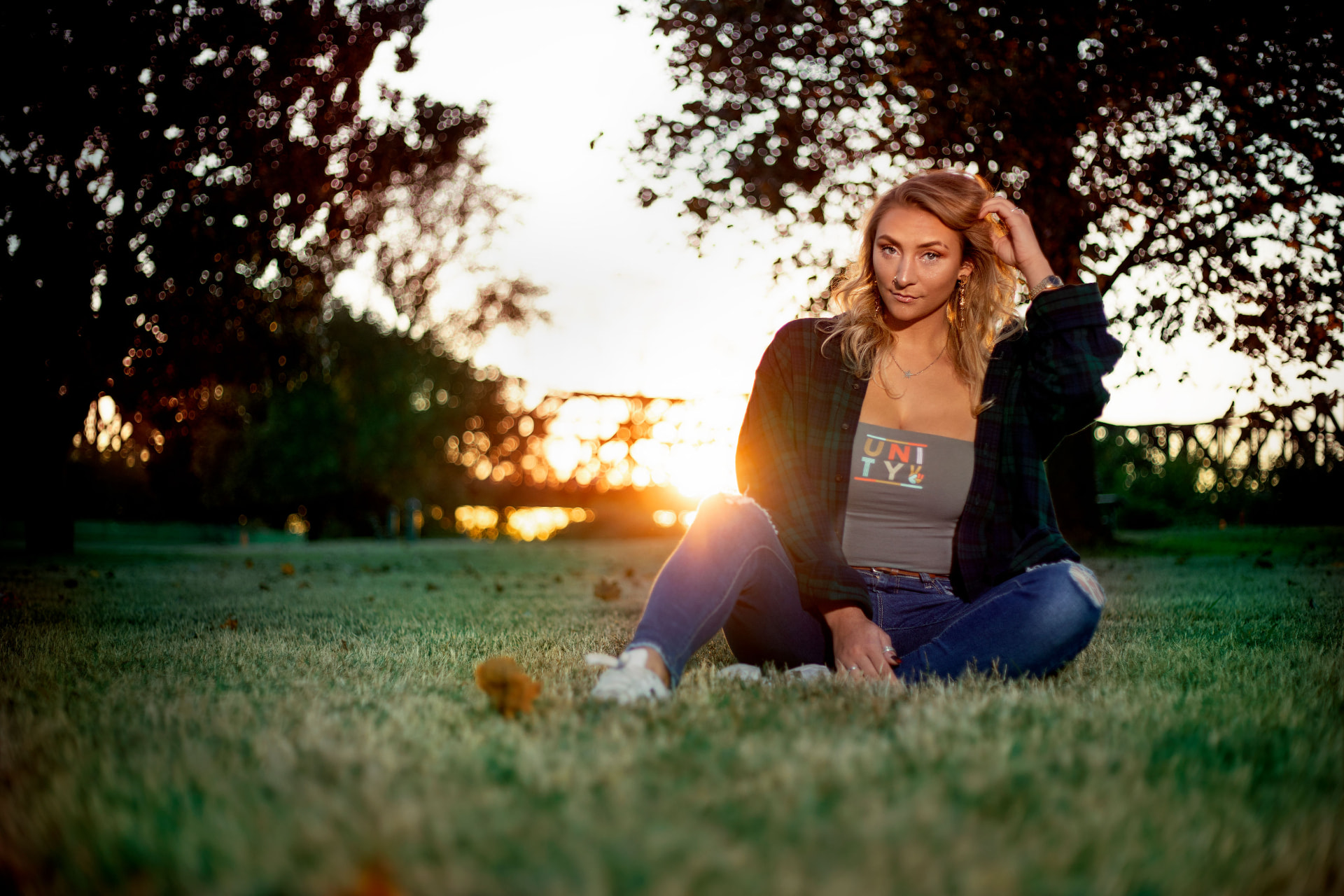 Senior portrait at sunset in an open park
